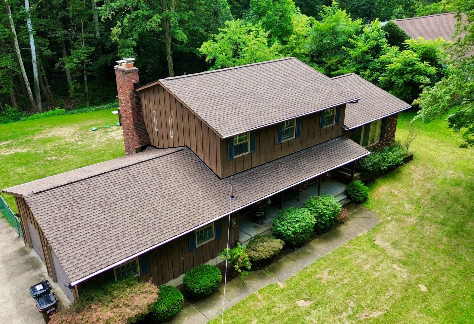 Home Tucked in Wooded Lot Gets a Roof Upgrade - Grafton roofing project