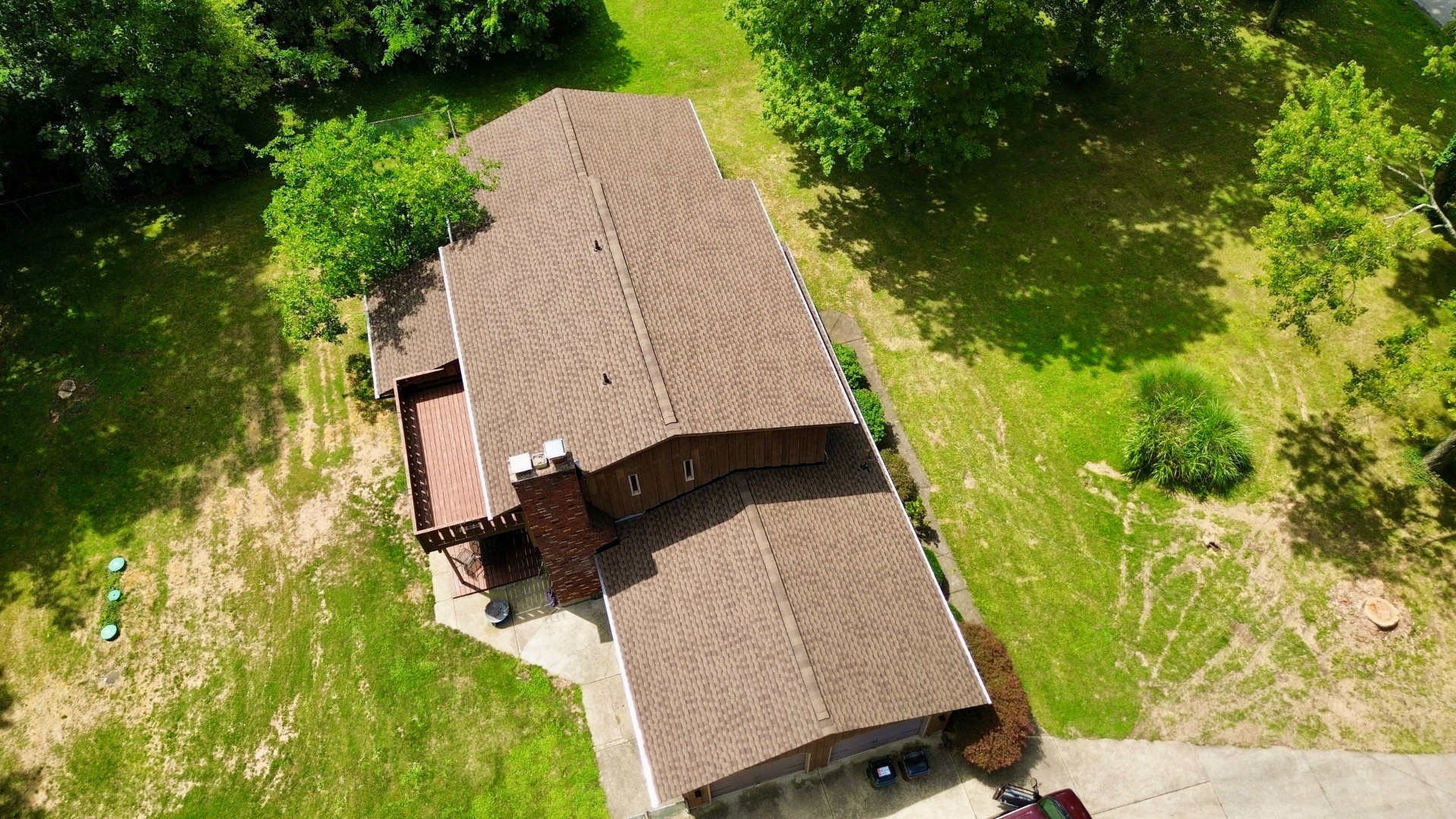 Home Tucked in Wooded Lot Gets a Roof Upgrade - additional view